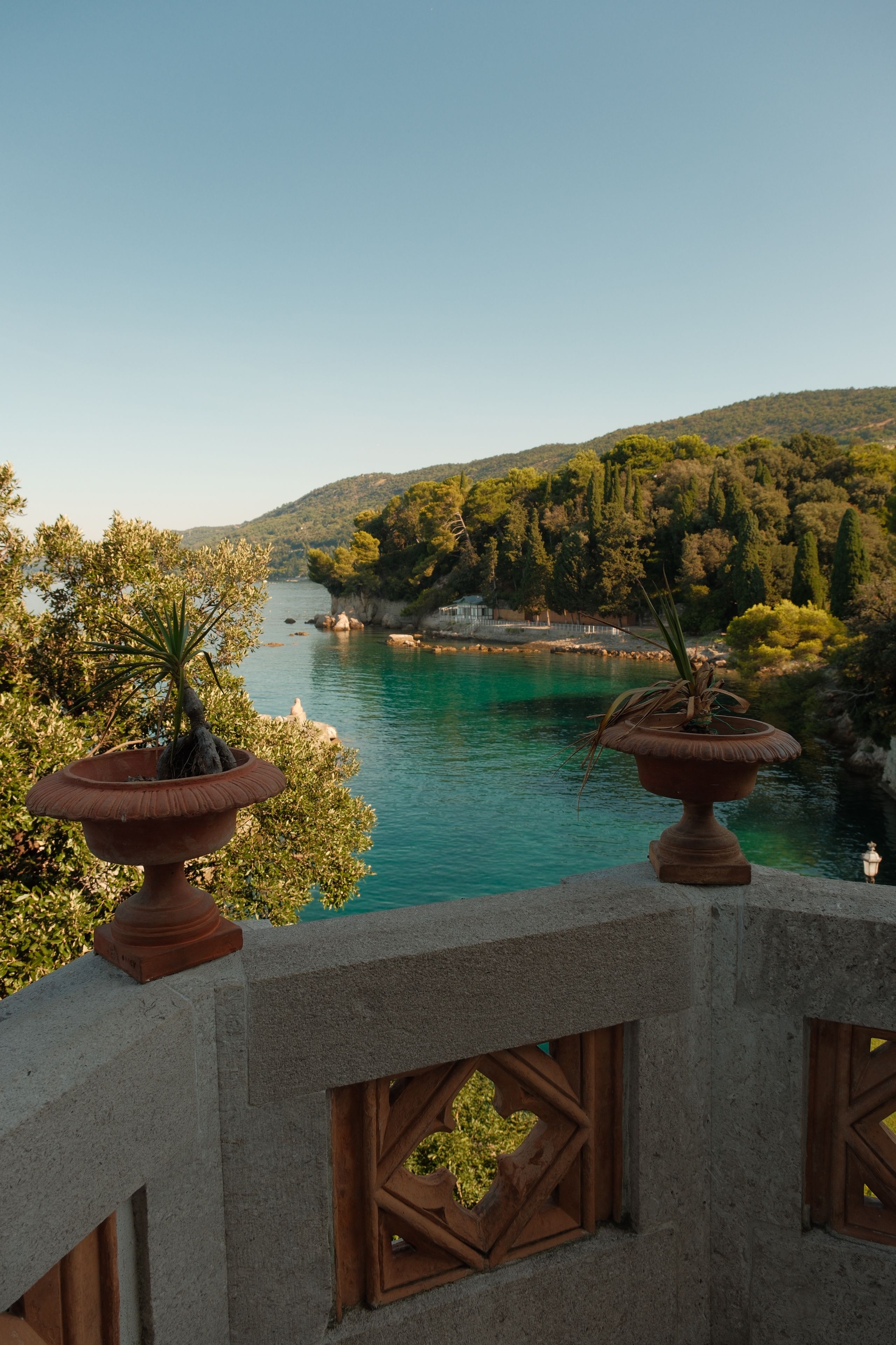 Serene view of Mediterranean coastline from an elegant terrace, capturing tranquil nature.
