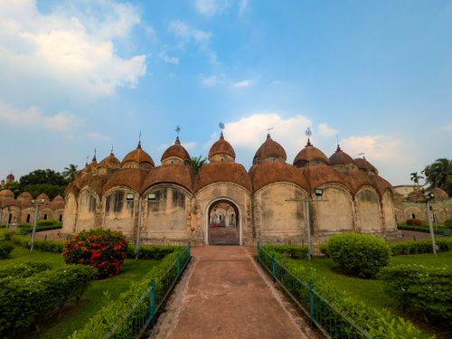 Free A beautiful shot of a historic Hindu temple with intricate domes under a clear sky. Stock Photo