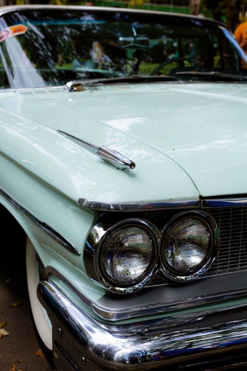 Free Detailed view of a vintage mint green classic car with chrome details. Stock Photo
