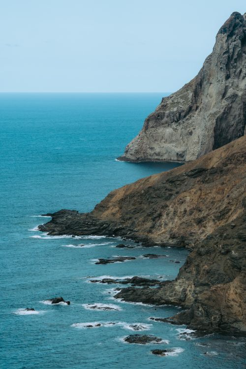 Free Stunning view of volcanic cliffs and rugged coastline at Arguamul, Spain. Stock Photo