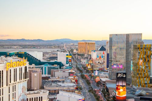 Free Captivating aerial view of the Las Vegas Strip skyline at sunset, featuring iconic hotels and casinos. Stock Photo