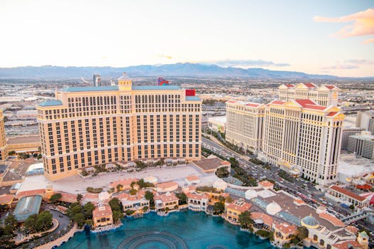 Captivating aerial photo of Las Vegas featuring iconic Bellagio and Caesar's Palace at sunset.