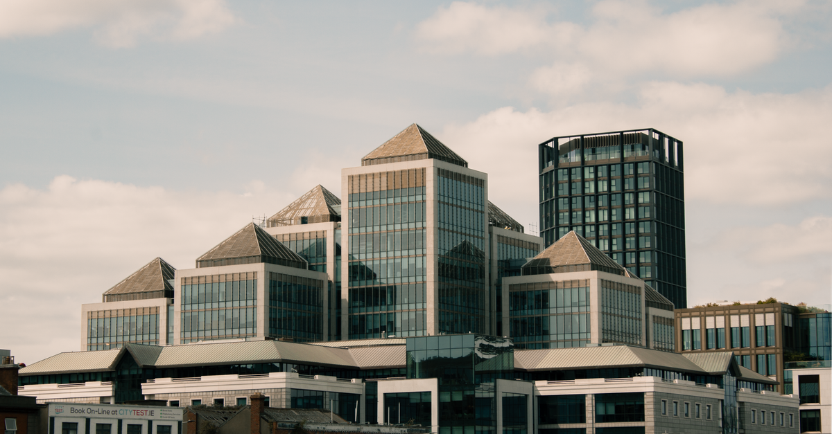 Contemporary buildings in Dublin showcasing modern architectural design under a clear sky.