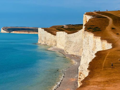 Free Breathtaking panoramic view of the iconic Seven Sisters cliffs along the English coastline. Stock Photo