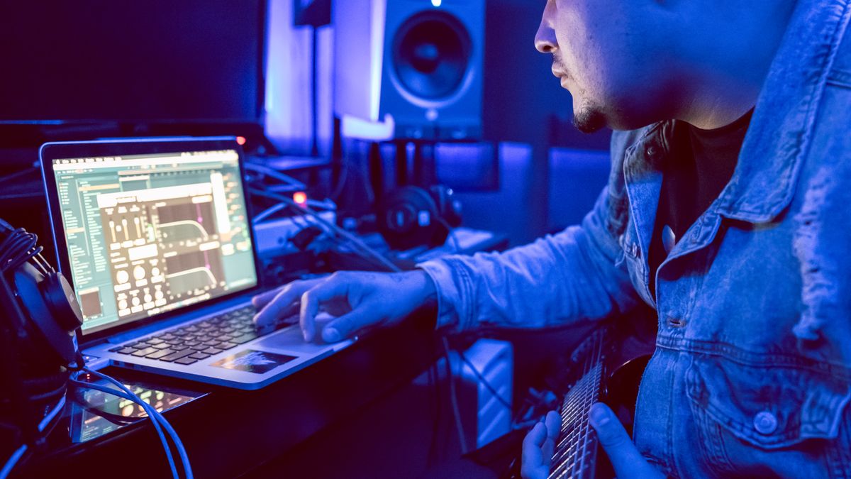Musician working on digital music production in a studio