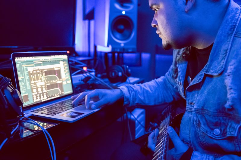 Music creator reviewing campaign performance on a laptop