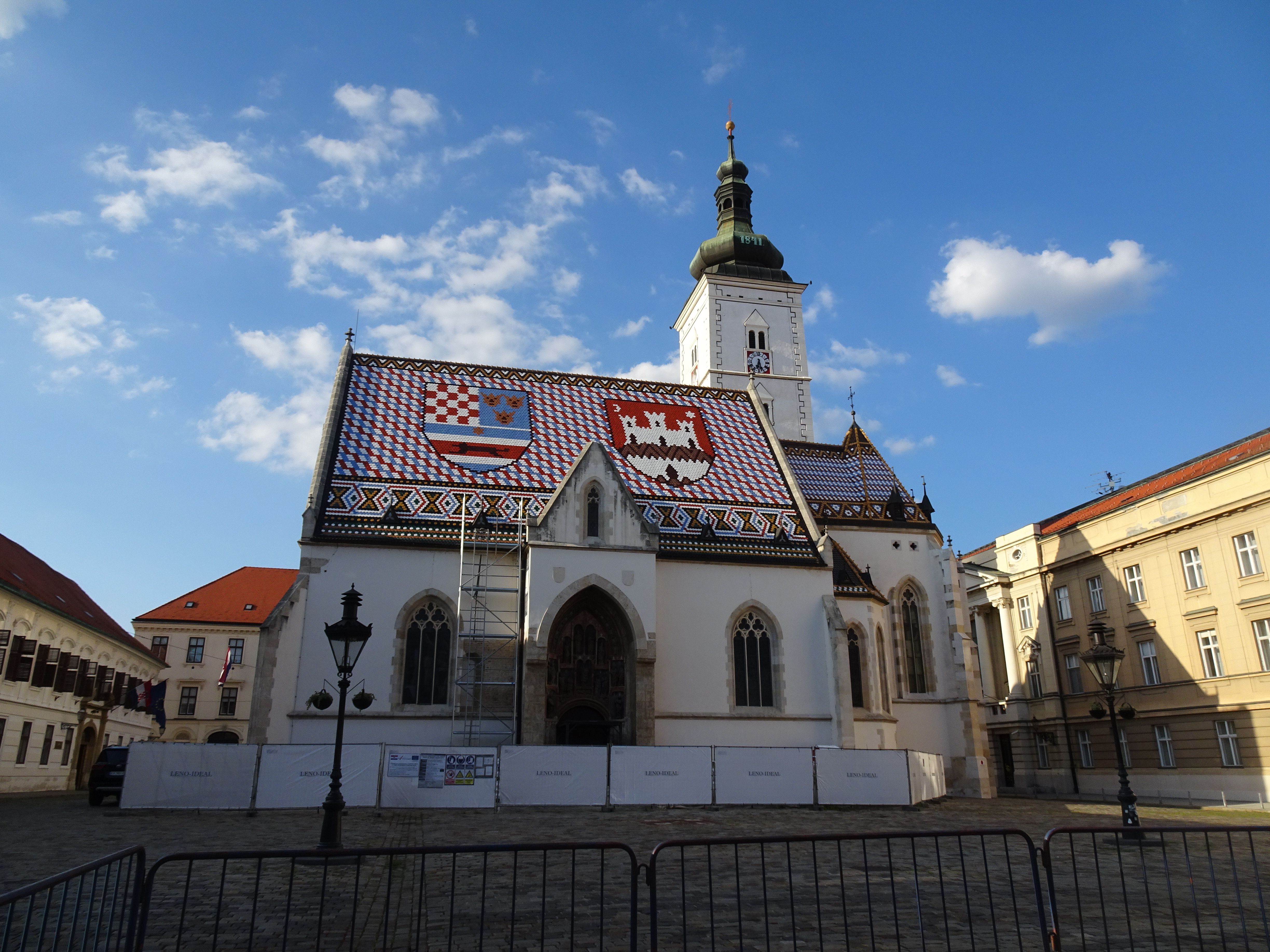 St. Mark's Church in Zagreb, Croatia features a vibrant tiled roof showcasing Croatian symbols.