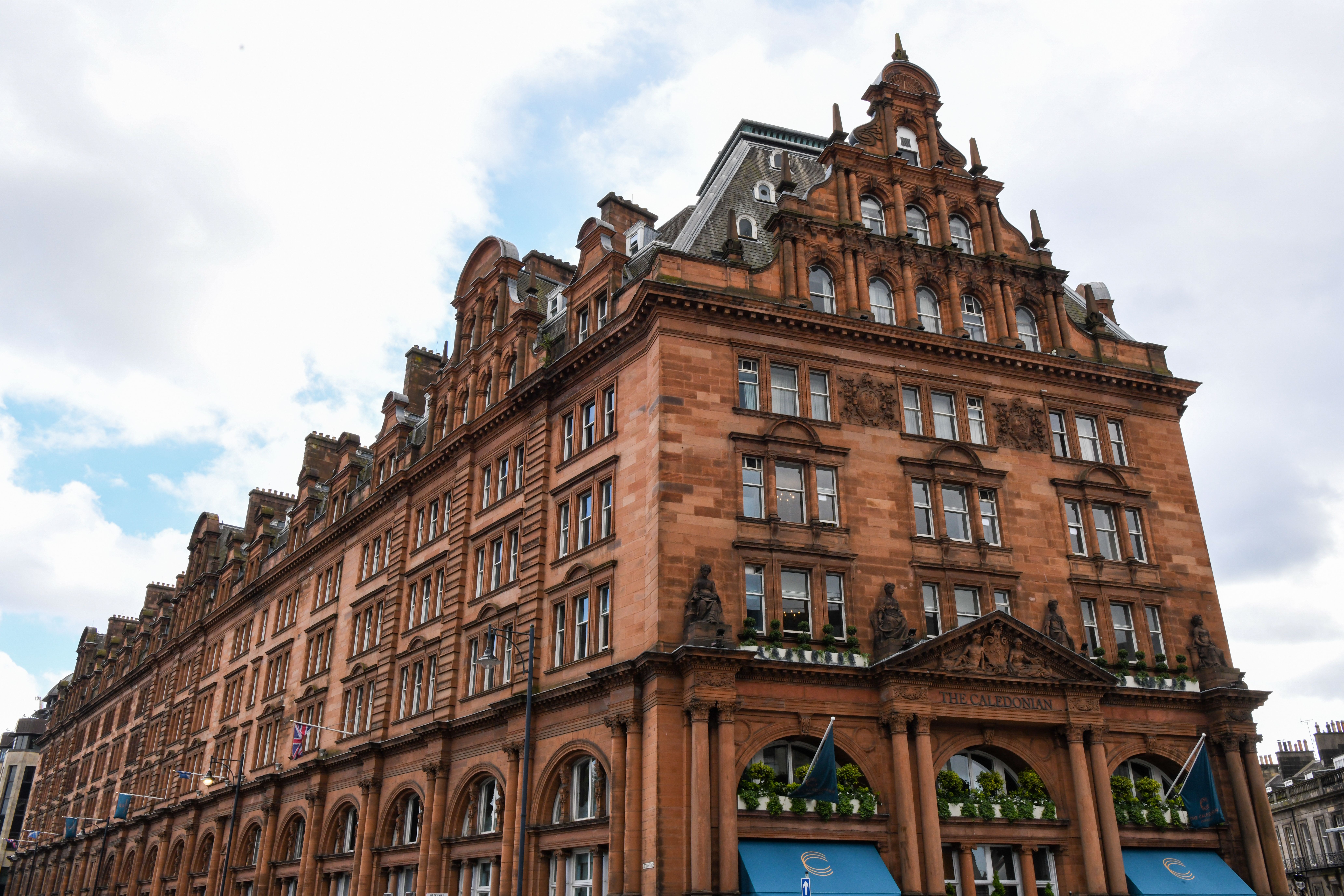 A striking view of the iconic The Caledonian hotel in Edinburgh, Scotland showcasing its intricate architecture.