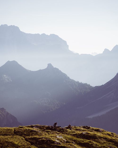 Free Serene view of the Dolomites in Trentino-Südtirol with majestic mountains and lush greenery. Stock Photo