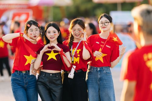 Free Four young women wearing festive attire with star symbols, enjoying an outdoor celebration. Stock Photo
