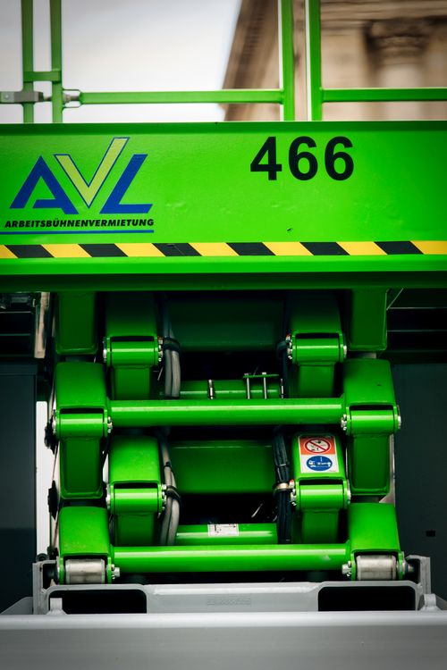 Free Close-up of green hydraulic machinery with safety symbols in Berlin, Germany. Stock Photo