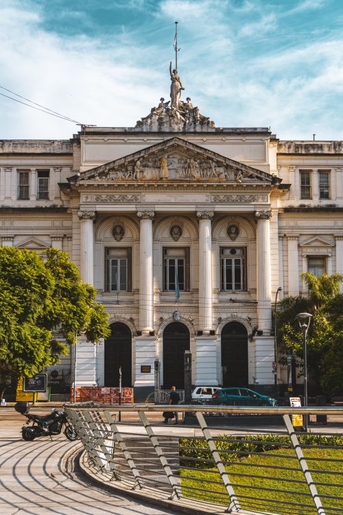 Free Stunning historic university building facade with intricate architectural details in a sunny outdoor setting. Stock Photo