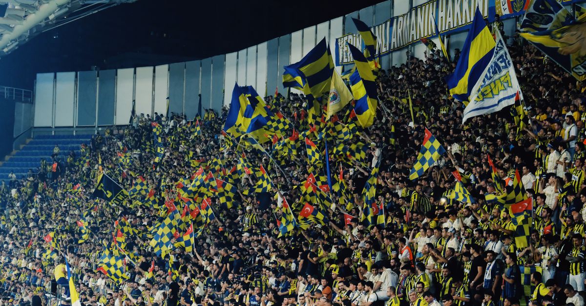 smart stadium with digital displays and packed crowd at night