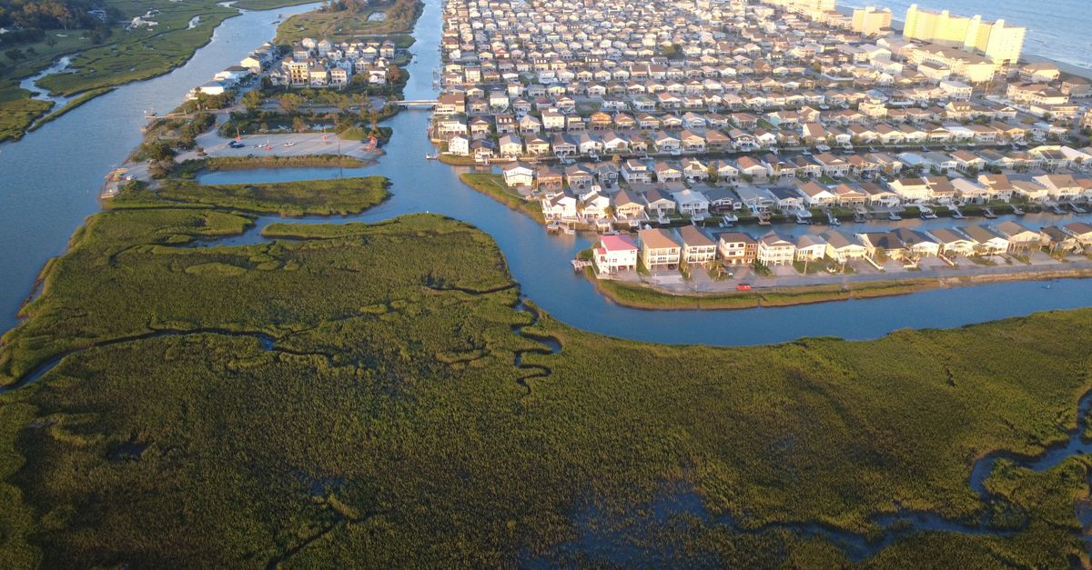 Aerial view showcasing the picturesque landscape of Cherry Grove Beach and its surrounding waterways.