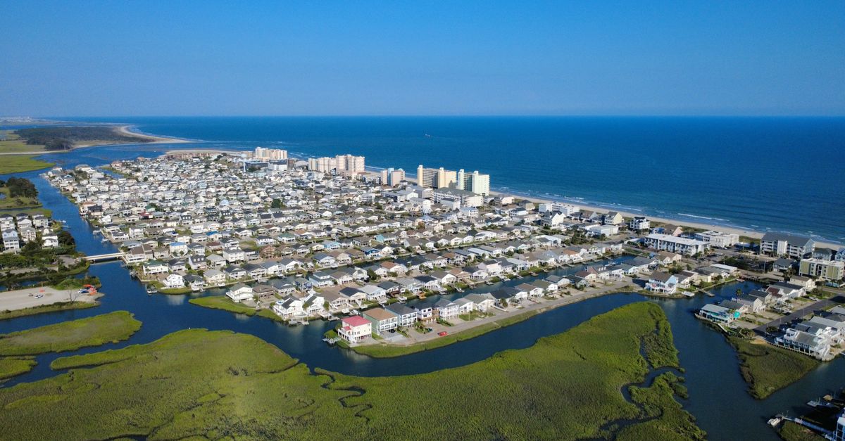 Stunning aerial view of Cherry Grove Beach, showcasing coastal homes and Atlantic Ocean scenery.
