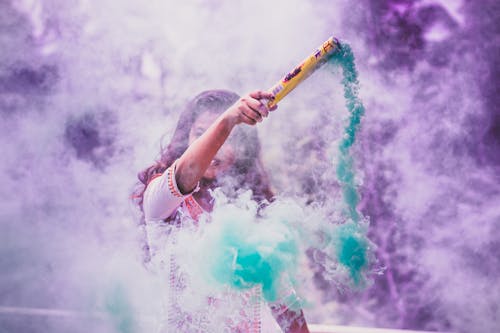 Woman Holding Colored Smoke Bomb