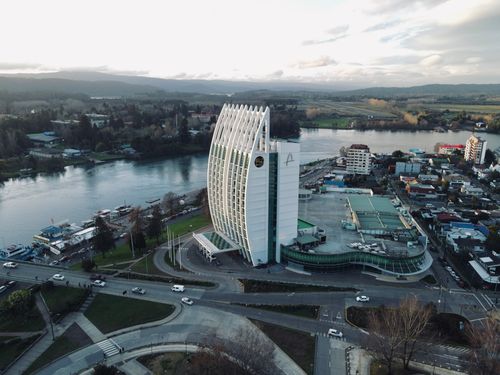 Free Aerial view of a unique modern building by the river in Valdivia, Chile. Stock Photo