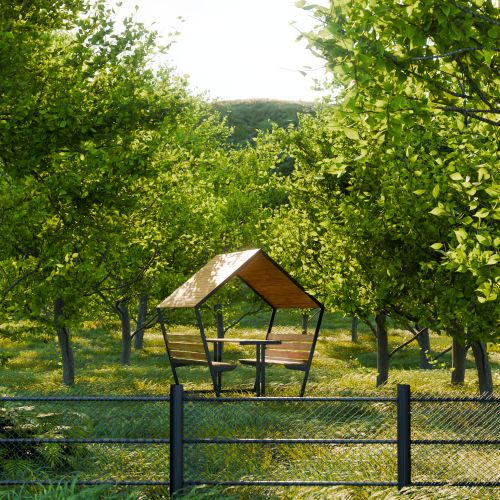 Free A tranquil picnic shelter amidst lush green trees in a sunlit orchard in Chieşd, Romania. Stock Photo