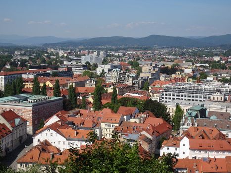 Panoramic view of Ljubljana with its iconic rooftops showcasing Slovenia's architectural charm.