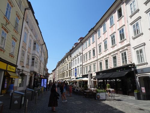 Free Explore the vibrant summer streets of Ljubljana, lined with classic architecture and bustling cafes. Stock Photo