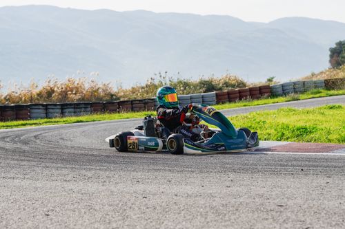 Free Experience the thrill of outdoor go-kart racing on a bright sunny day with mountains in the background. Stock Photo