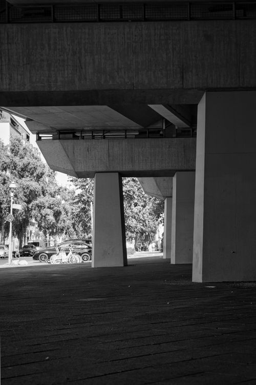 Free A modern urban scene in Berlin showcasing concrete structures and city life. Stock Photo