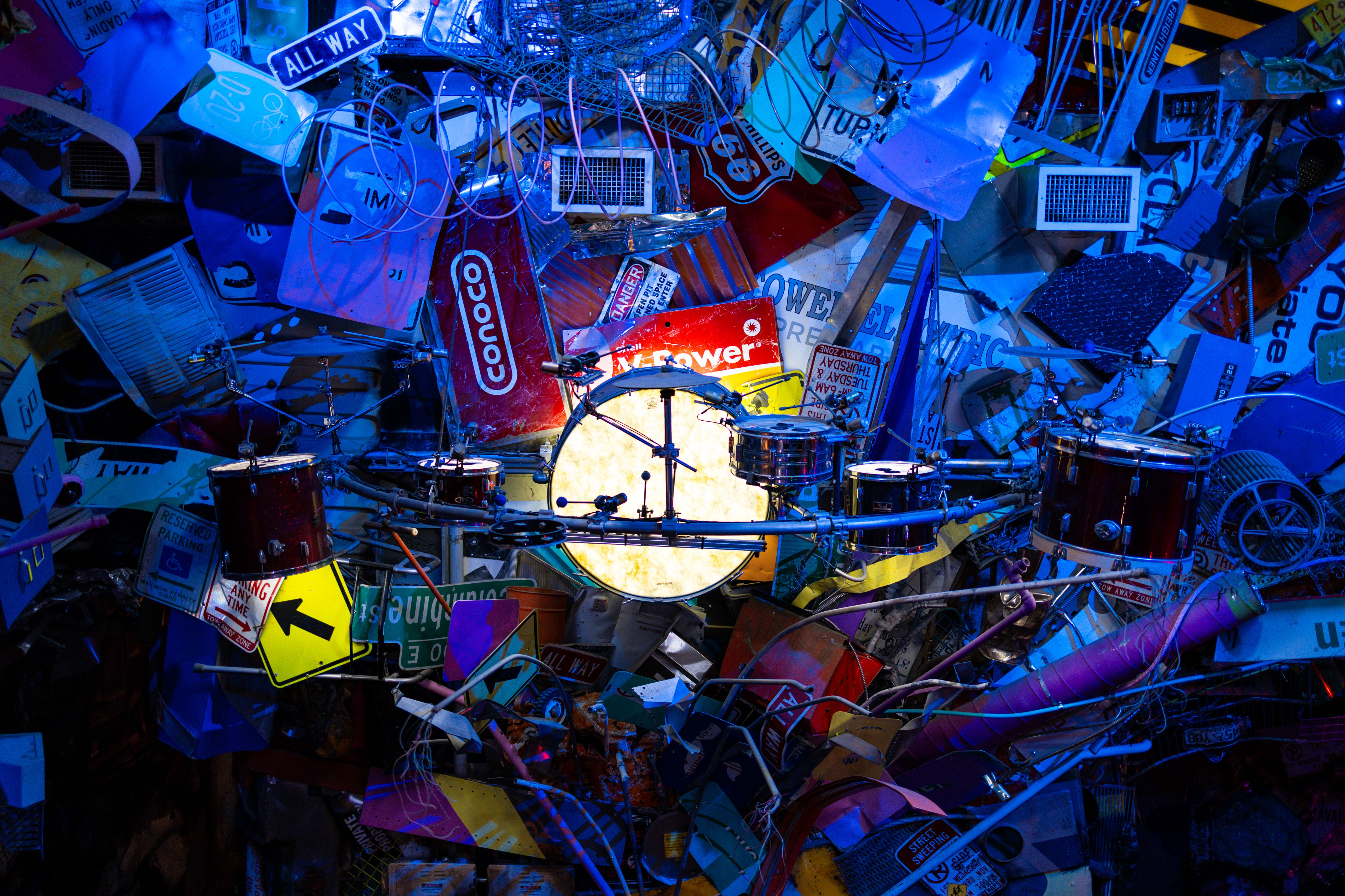 Eclectic urban art piece featuring drums and recycled materials in Denver.