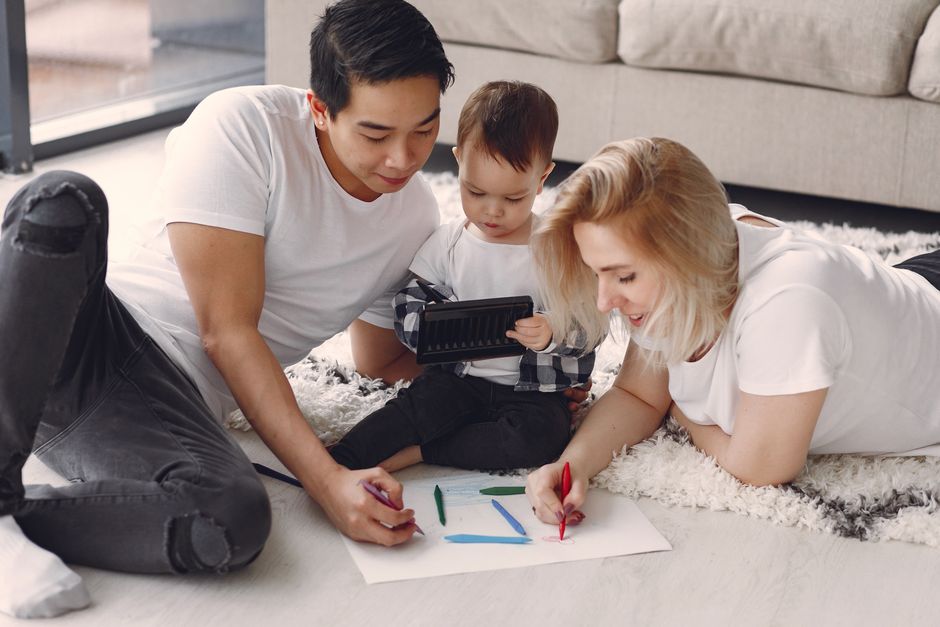 Photo by Gustavo Fring on Pexels A loving family of three drawing together on the floor of their cozy living room. - Photo by Gustavo Fring on Pexels