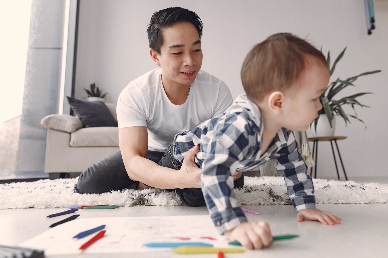 Paediatric clinician holding a baby, online AI CPD for paediatric allied health professionals