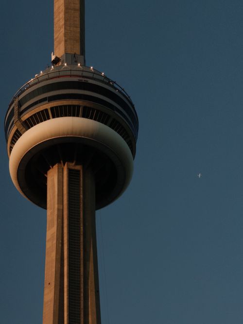 Free Close-up view of the CN Tower against a clear sky, capturing architectural detail. Stock Photo