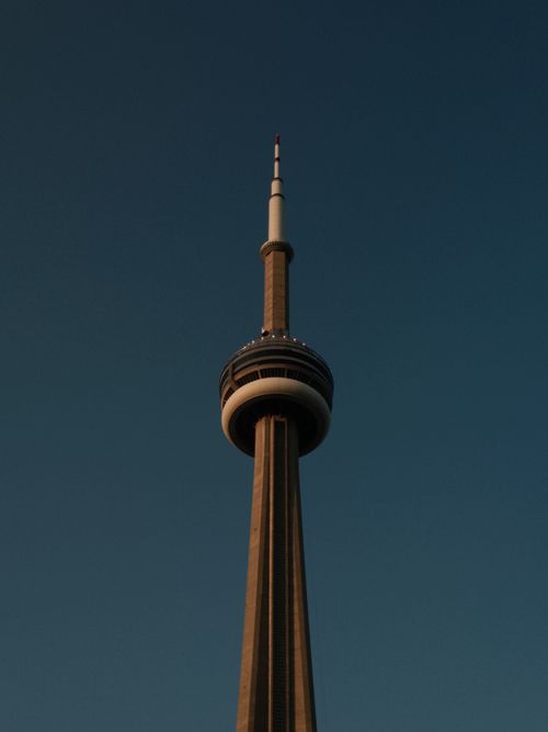 Free Dramatic view of the CN Tower in Toronto against a twilight sky, showcasing modern architecture. Stock Photo