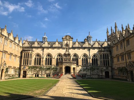 Beautiful view of a historic Oxford University quad under a clear blue sky.