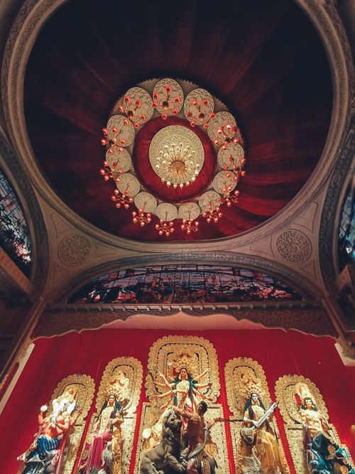 Free Stunning ceiling and deity display in a Kolkata Durga Puja pandal, showcasing cultural artistry. Stock Photo