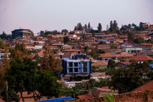 Free A vibrant panorama of Kigali's residential area showcasing architecture and greenery at sunset. Stock Photo
