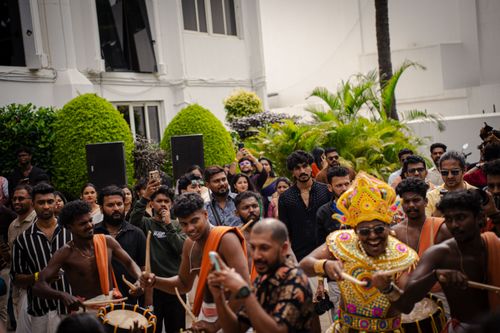 Free A lively outdoor cultural dance performance with traditional costumes and drums, engaging a large crowd. Stock Photo