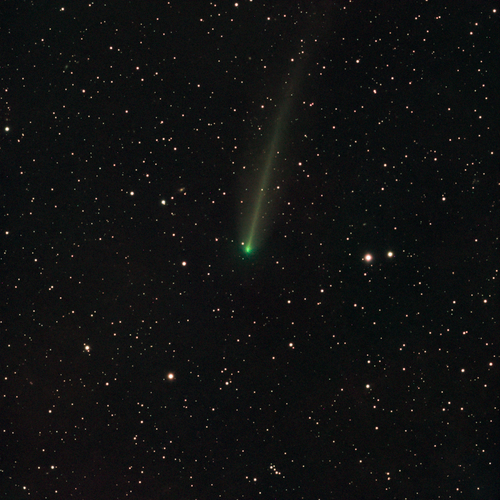 Free A vivid green comet streaks across the star-filled sky in São Pedro de Alcântara, Brazil. Stock Photo