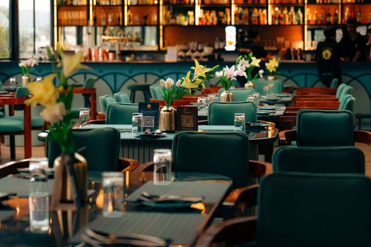 Upscale boutique cafe interior featuring floral decor and ambient lighting for a cozy experience.