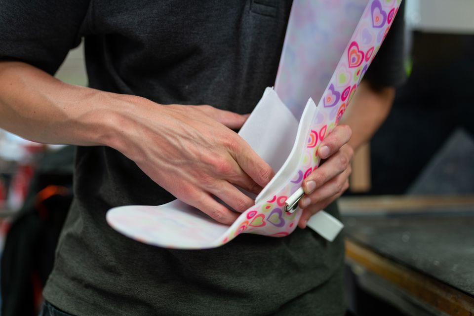 Hands fitting a custom foot orthotic