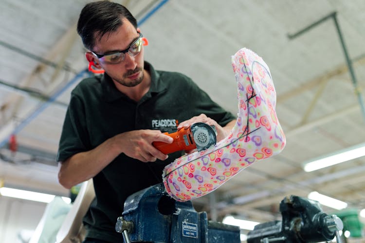 Man Using Handheld Cutter