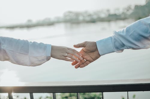 Free Man And Woman Holding Hands Stock Photo