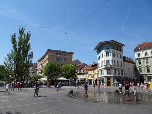 Free Bustling streets of Ljubljana with historic architecture and lively summer atmosphere. Stock Photo