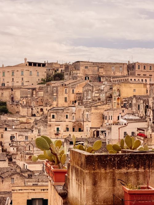 Free Explore Matera's ancient architecture with sandstone buildings under a cloudy sky. Stock Photo