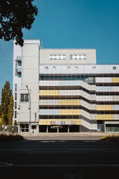 Contemporary parking structure under clear Berlin sky, showcasing urban architecture.