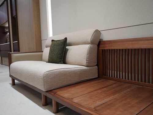 Free Elegant modern sofa with wood and fabric design in a stylish indoor setting. Stock Photo