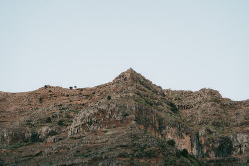 Free Rugged volcanic landscape in Valle Gran Rey, Canary Islands, showcasing rocky terrain and unique geology. Stock Photo