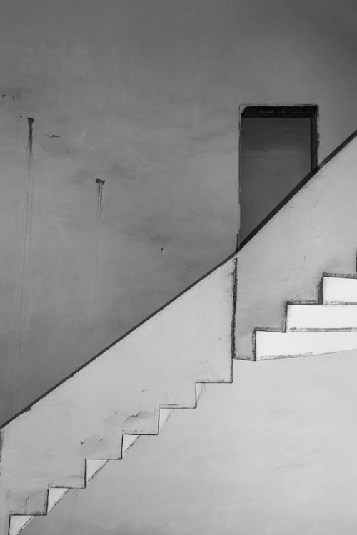 Free Minimalist black and white staircase with geometric lines and shadows. Stock Photo