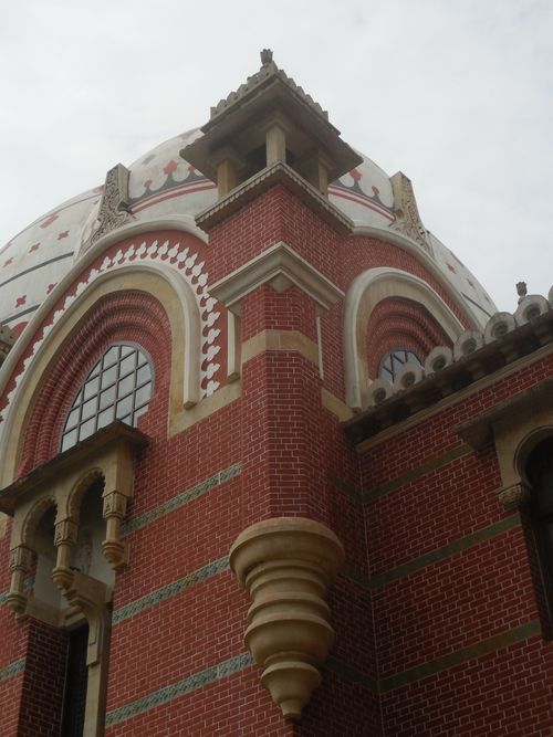 Free Close-up of historic red brick building architecture with intricate designs. Stock Photo