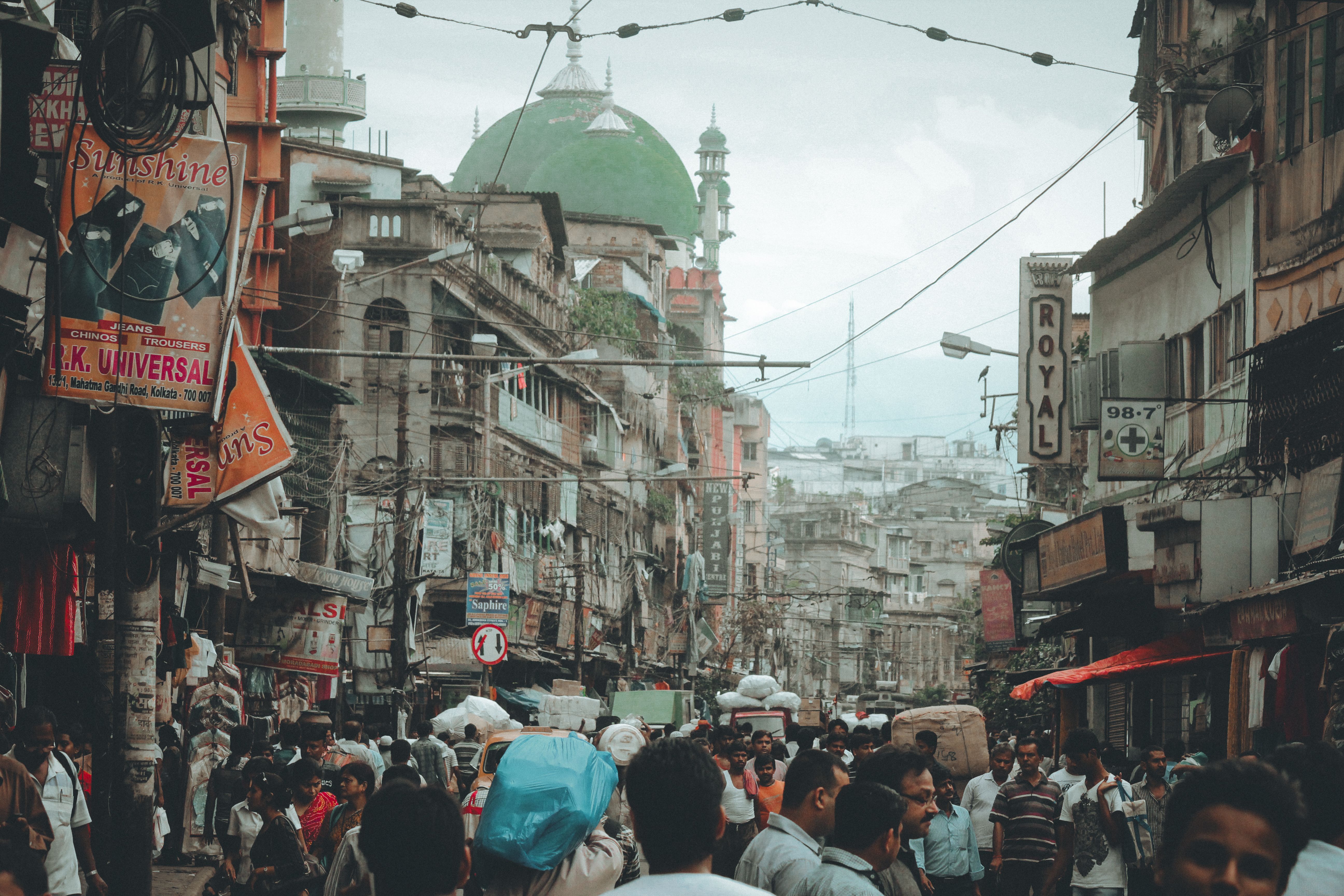 Green flags over the lane leading to Mahim Dargah with the causeway traffic behind