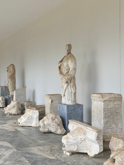 Free Intriguing display of ancient Greek statues and artifacts in a historical site. Stock Photo