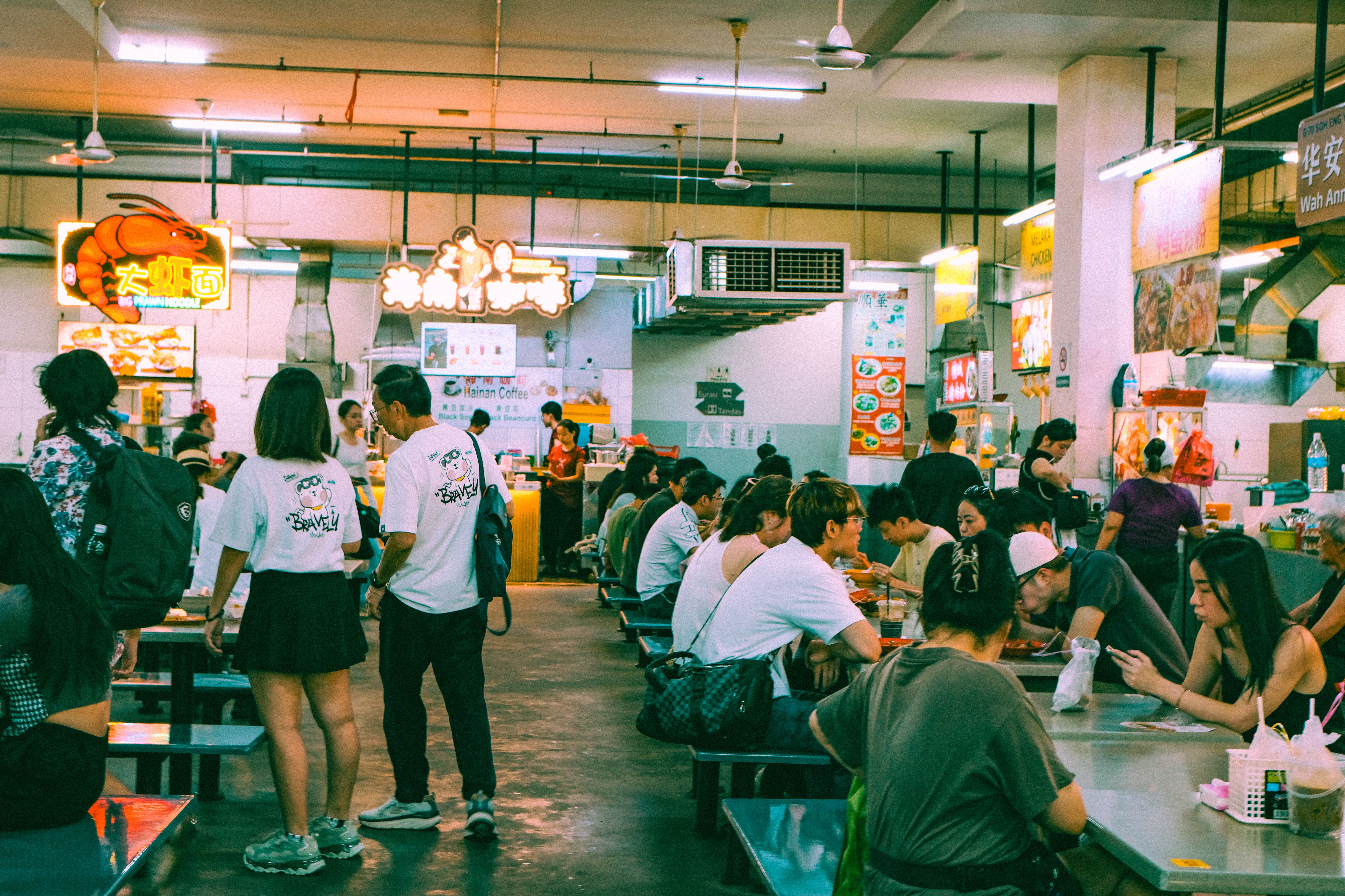 A bustling dining room with food counters
